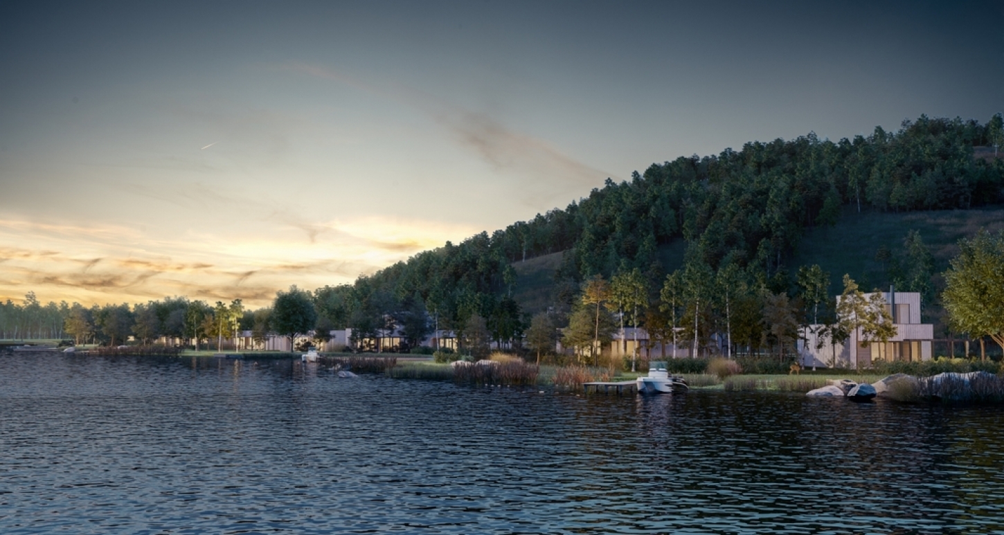 Zicht op het Terhills Resort by Center Parcs vanop het water.